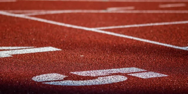 Red running sport track background and texture. Sport running track concept.