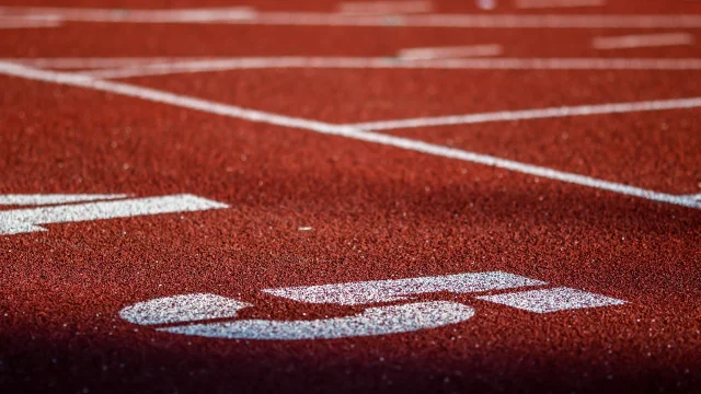 Red running sport track background and texture. Sport running track concept.