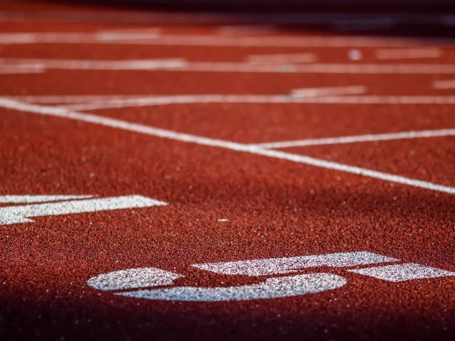 Red running sport track background and texture. Sport running track concept.